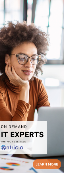 Women looking at laptop in office